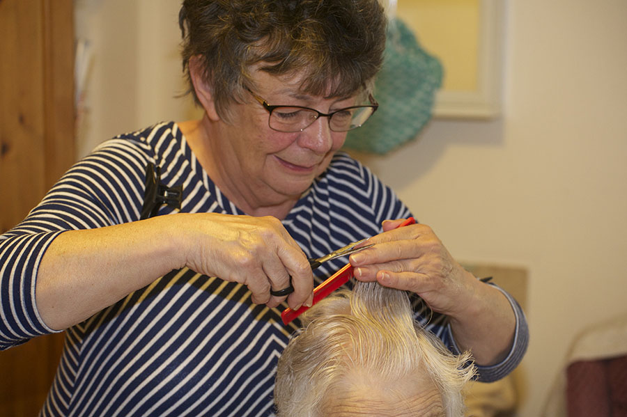 Resident at Brookside having her hair done